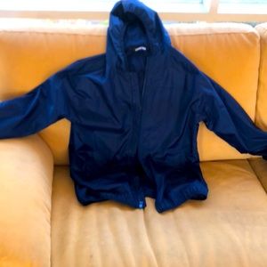 Child’s rain jacket.  Light navy mesh lining and hidden pocket at the back.